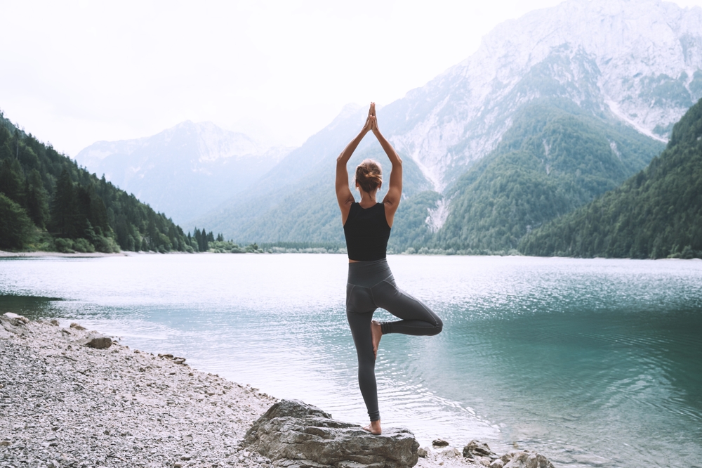 woman doing yoga. wellness travel venice fl