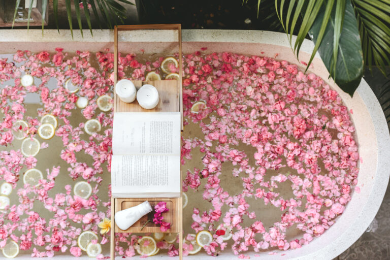 Top,View,Of,Bath,Tub,With,Flower,Petals,And,Lemon